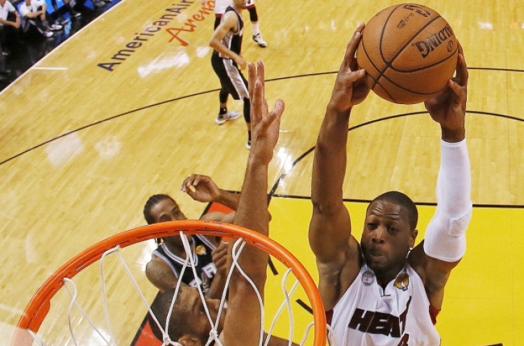 Heat beats Spurs in OT, forcing Game 7