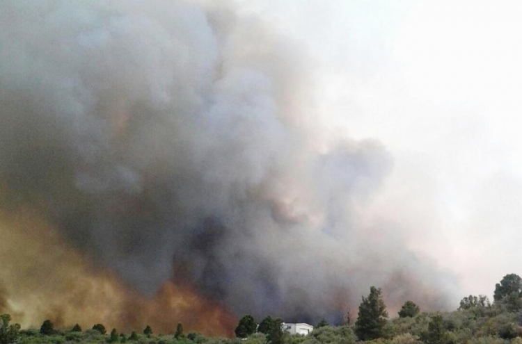 Wildfire grows in Arizona after killing 19 firefighters