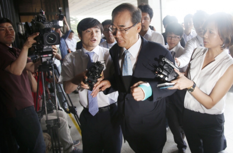 Former tax chief appears for questioning over bribery