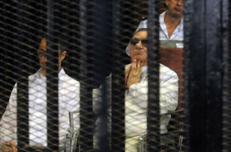 Mubarak back in Egypt court, Brotherhood trial adjourned