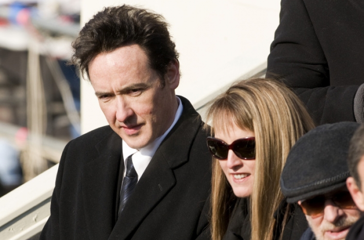 Woman charged with stalking U.S. actor John Cusack