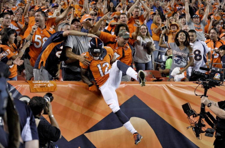 Manning’s 7 TDs lead Broncos past Ravens 49-27