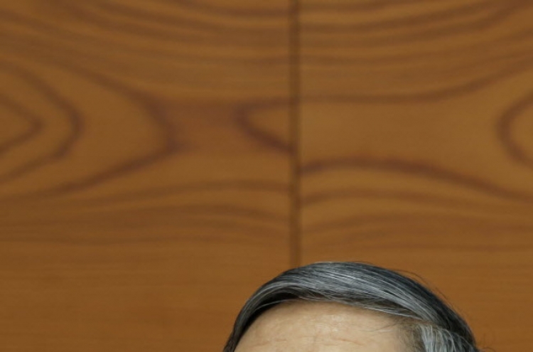 BOJ keeps loose money policy, says economy on mend