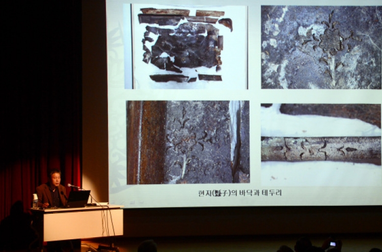 Early Goryeo lacquer box under spotlight