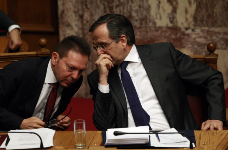 Greece approves tough budget