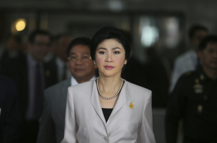 Thai P.M. says won’t resign before polls