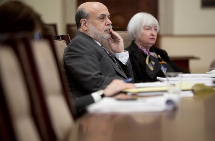 Yellen sworn in as Bernanke joins Brookings