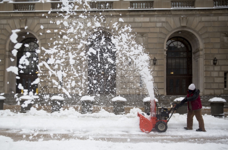 Cold weather slows economic growth