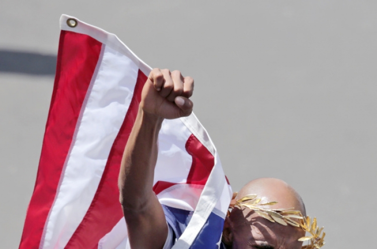 Runners reclaim Boston Marathon