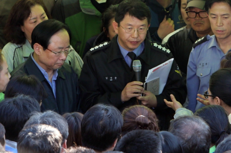 Families of ferry's lost confront Korean officials