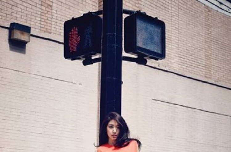 Park Shin-hye poses in feminine outfits