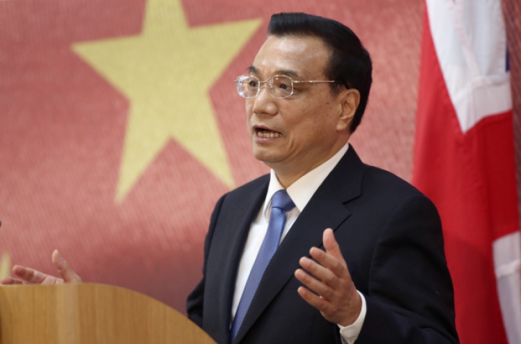 China will avoid hard landing while limiting stimulus, Li says