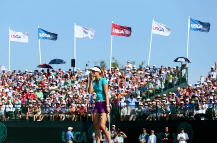 Wie holds on to win Women’s Open