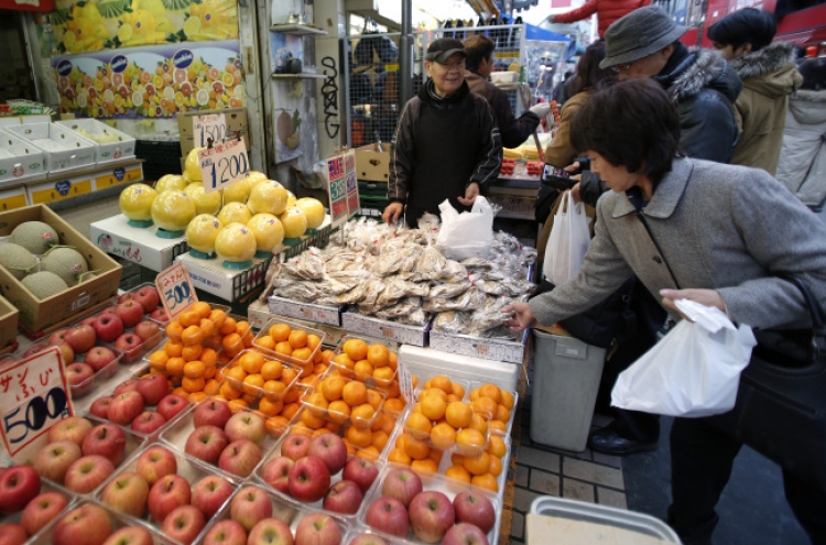 Abe declares end of deflation