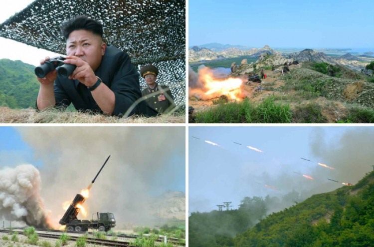 N.K. leader oversees live-shell firing exercise