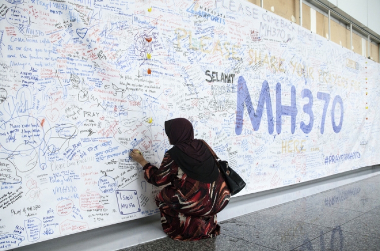 Families wage civic campaign to solve MH370 mystery