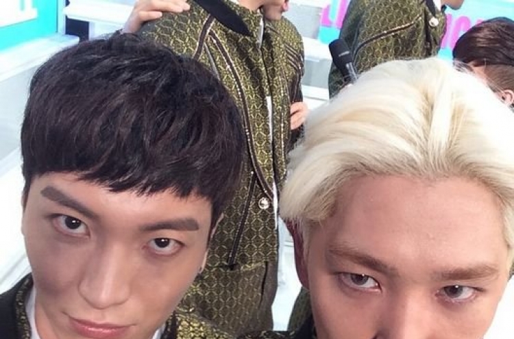 Super Junior’s Kangin and Leeteuk make sour faces