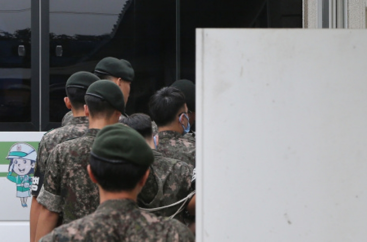 Prosecution files murder charges against 4 soldiers in abuse case