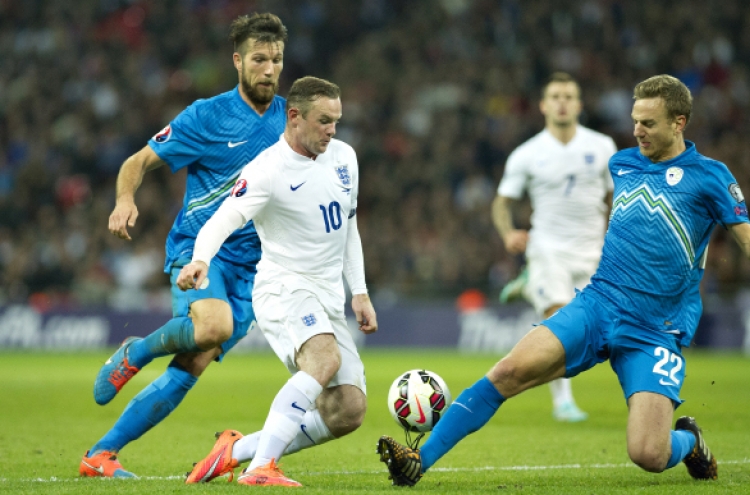 Rooney finds net in 100th match for England