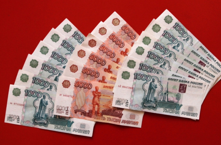 Western sanctions, ruble crash hit Russians hard