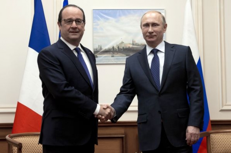Putin, Hollande attempt to defuse Ukraine tensions