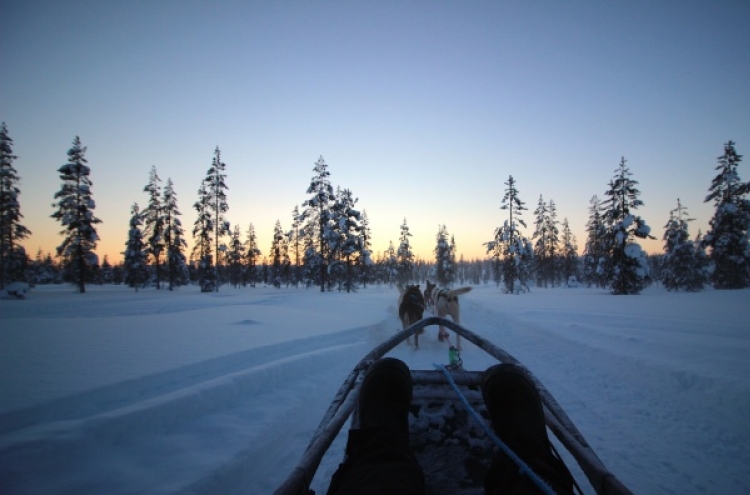 Basking under aurora-canvased winter skies of Finland