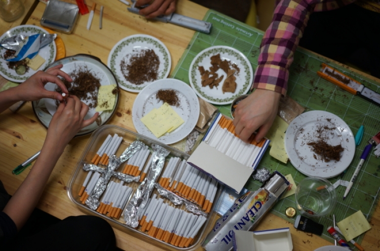 Cigarette making becomes art project