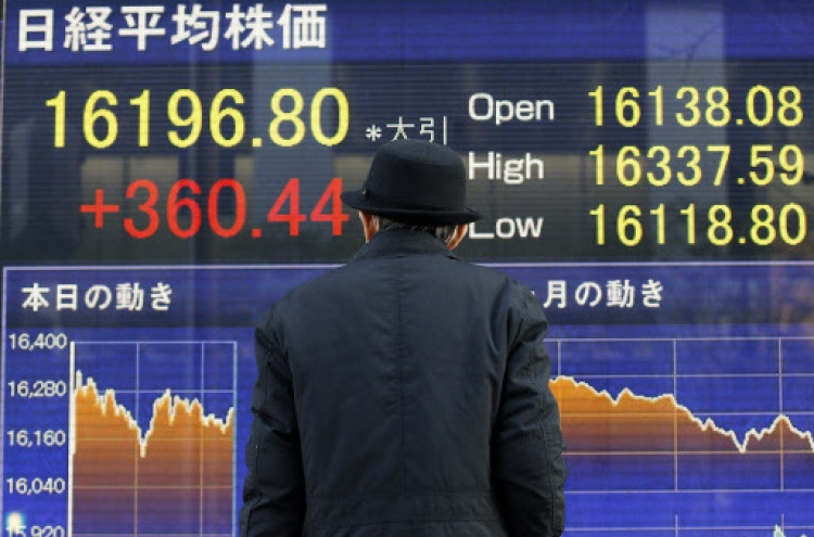 Tokyo stocks fall sharply by break on stronger yen, weaker oil