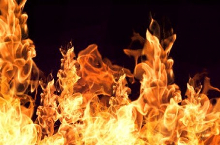 Woman attempts suicide by arson