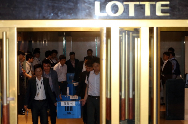 Lotte hires major law firms for defense as probe widens