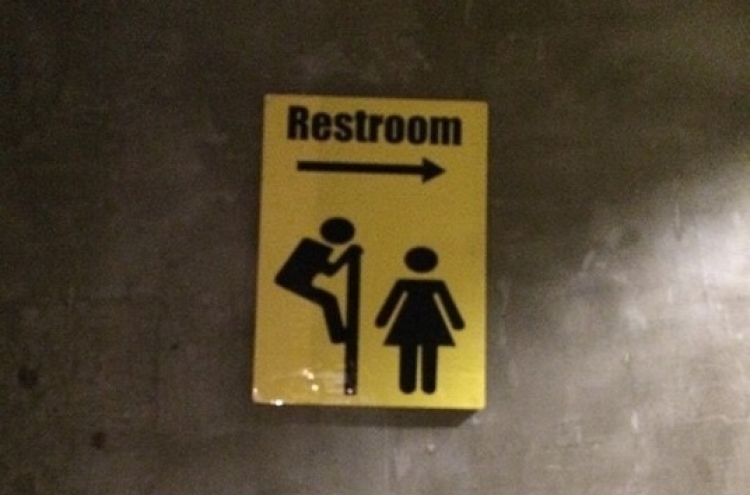 Voyeuristic public toilet signs in Seoul stir controversy