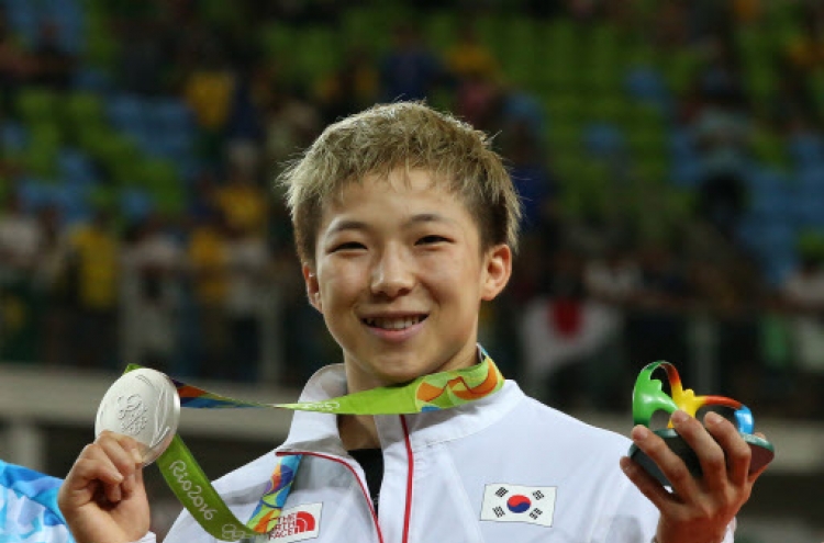 Once aspiring president, South Korean judoka embraces 1st Olympic medal