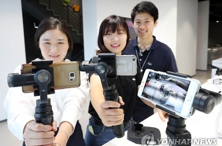 DJI unveils 3-axis handheld stabilizer for phone camera