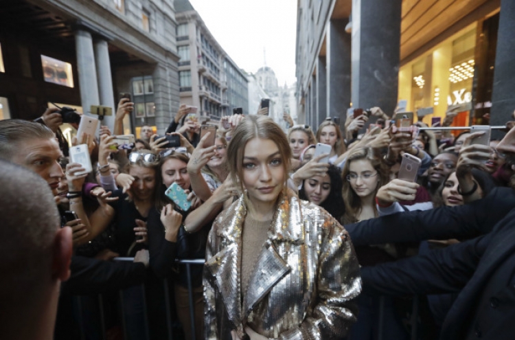 Gigi Hadid fends off manhandler between runway turns