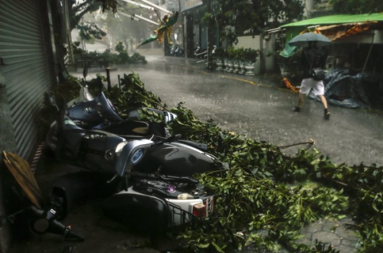 Strong winds from big typhoon hit Taiwan, at least 4 dead