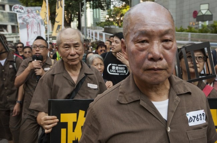 Crowds rally in Hong Kong after activists jailed