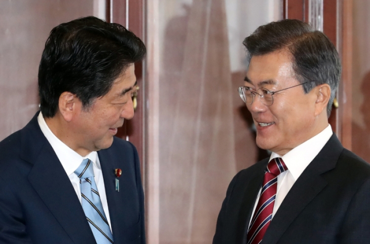 Moon, Abe vow to seek oil supply cut to punish N. Korea