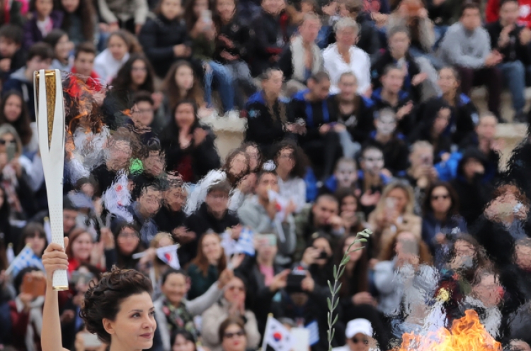 Olympic flame handed over to S. Korean organizers of PyeongChang 2018