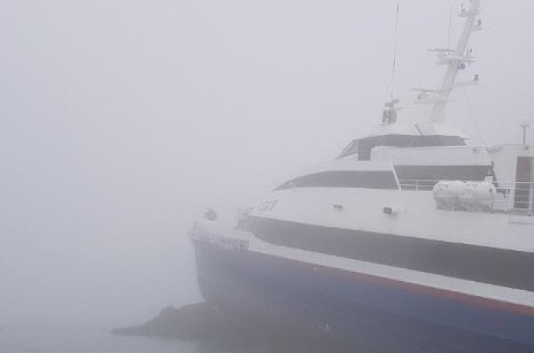 Ferry grounded on rocks off the coast of Sinan