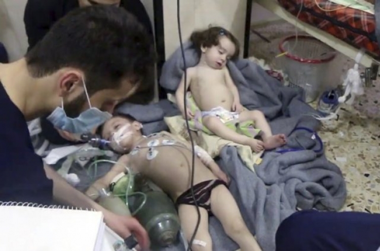 Suspected poison gas kills at least 40 in Damascus suburb