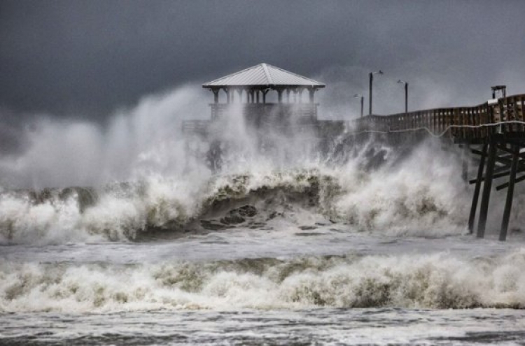 ‘Threat becomes reality’: Florence begins days of rain, wind