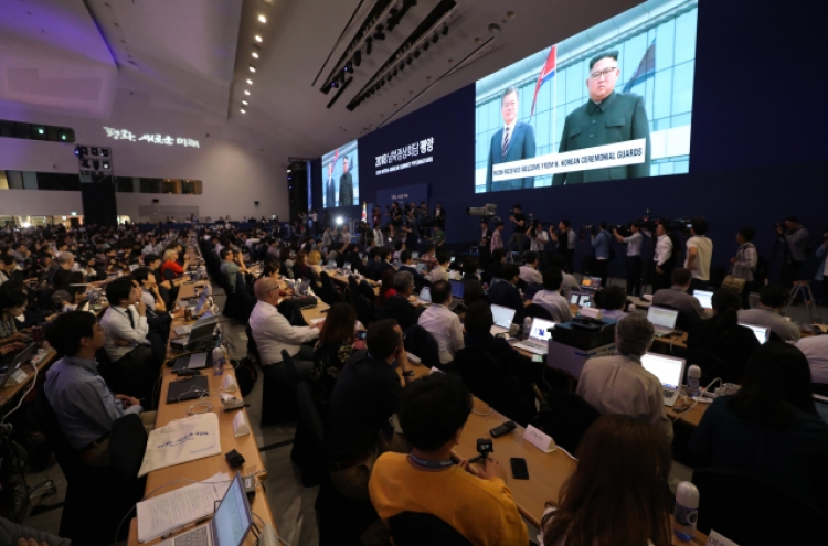 Journalists cover inter-Korean summit with measured excitement