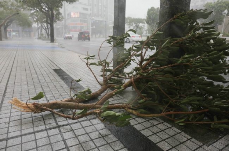 Powerful typhoon batters Okinawa, churns to Japan mainland