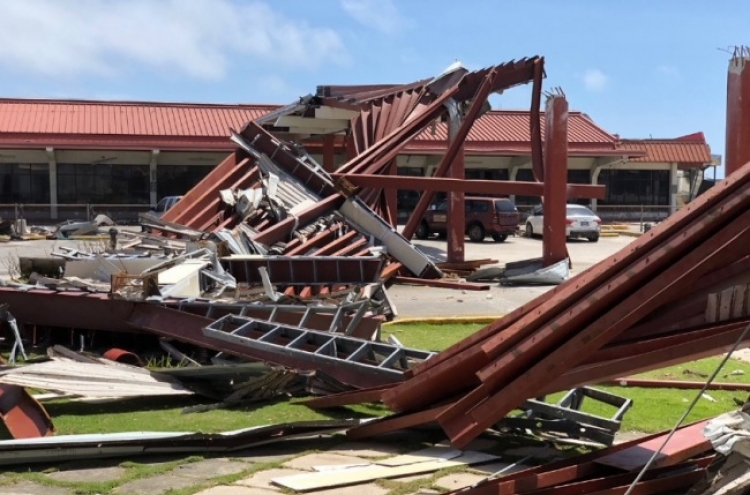 Typhoon crumbles homes, kills 1 in Northern Mariana Islands