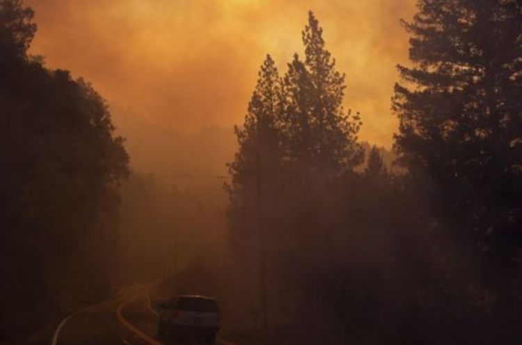 Hearses stand by as crews search for California fire victims