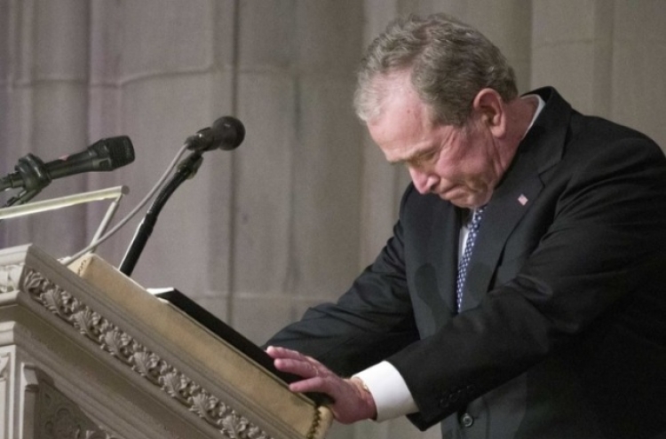 Nation bids goodbye to Bush with high praise, cannons, humor