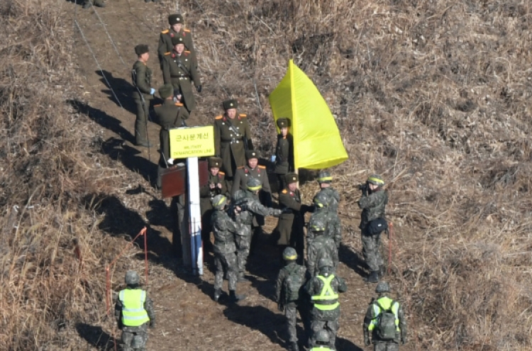 In a first for the two Koreas, inspectors verify removal of front-line guard posts