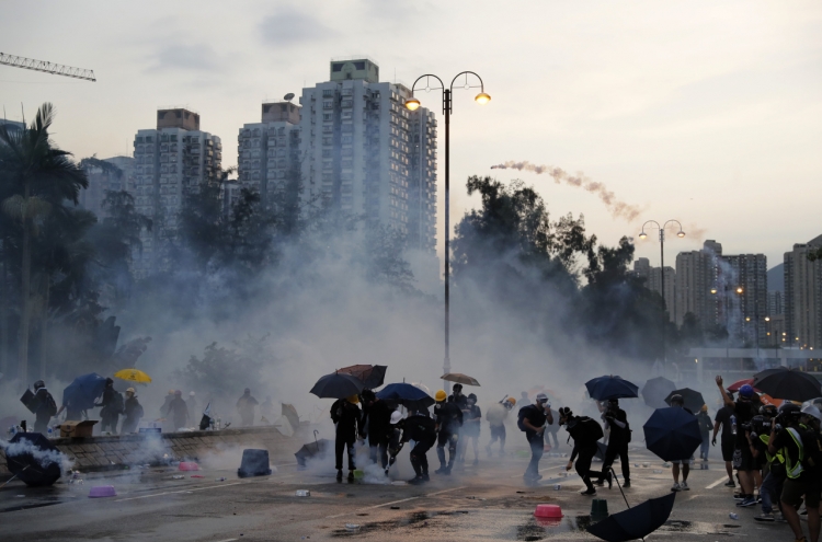 Hong Kong unrest spreads as leader warns city on brink