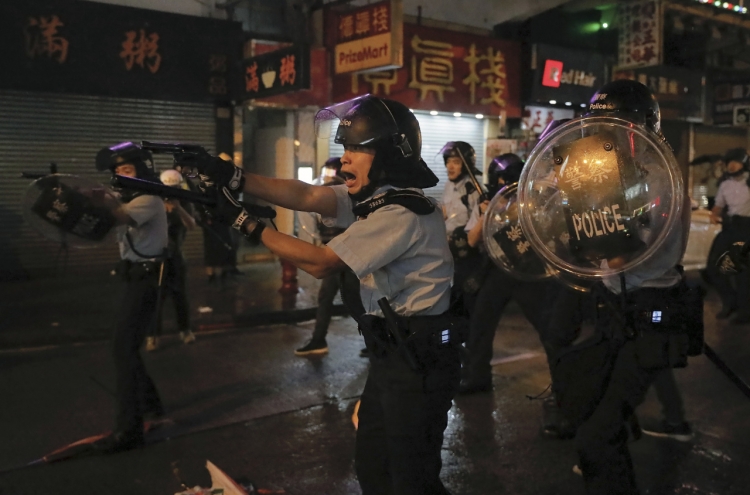 Hong Kong police fire first gunshot, water cannon in protest clashes