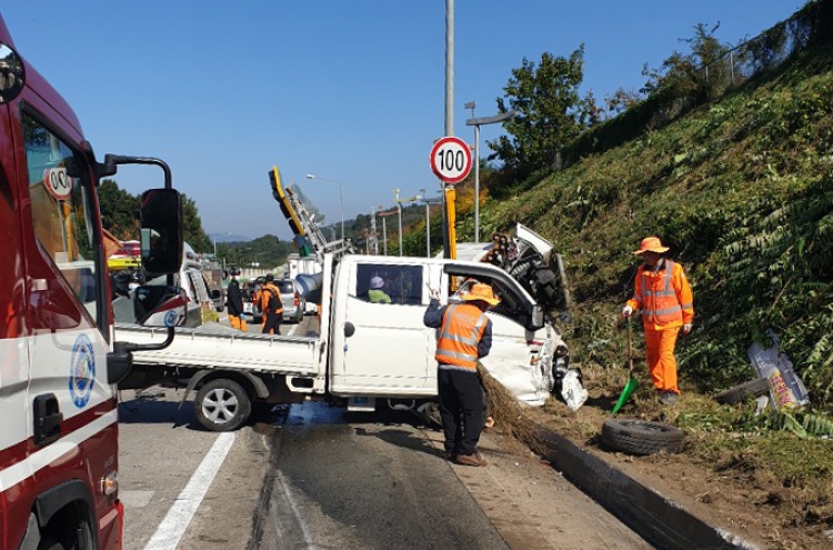 Three workers cutting grass killed after expressway truck collision